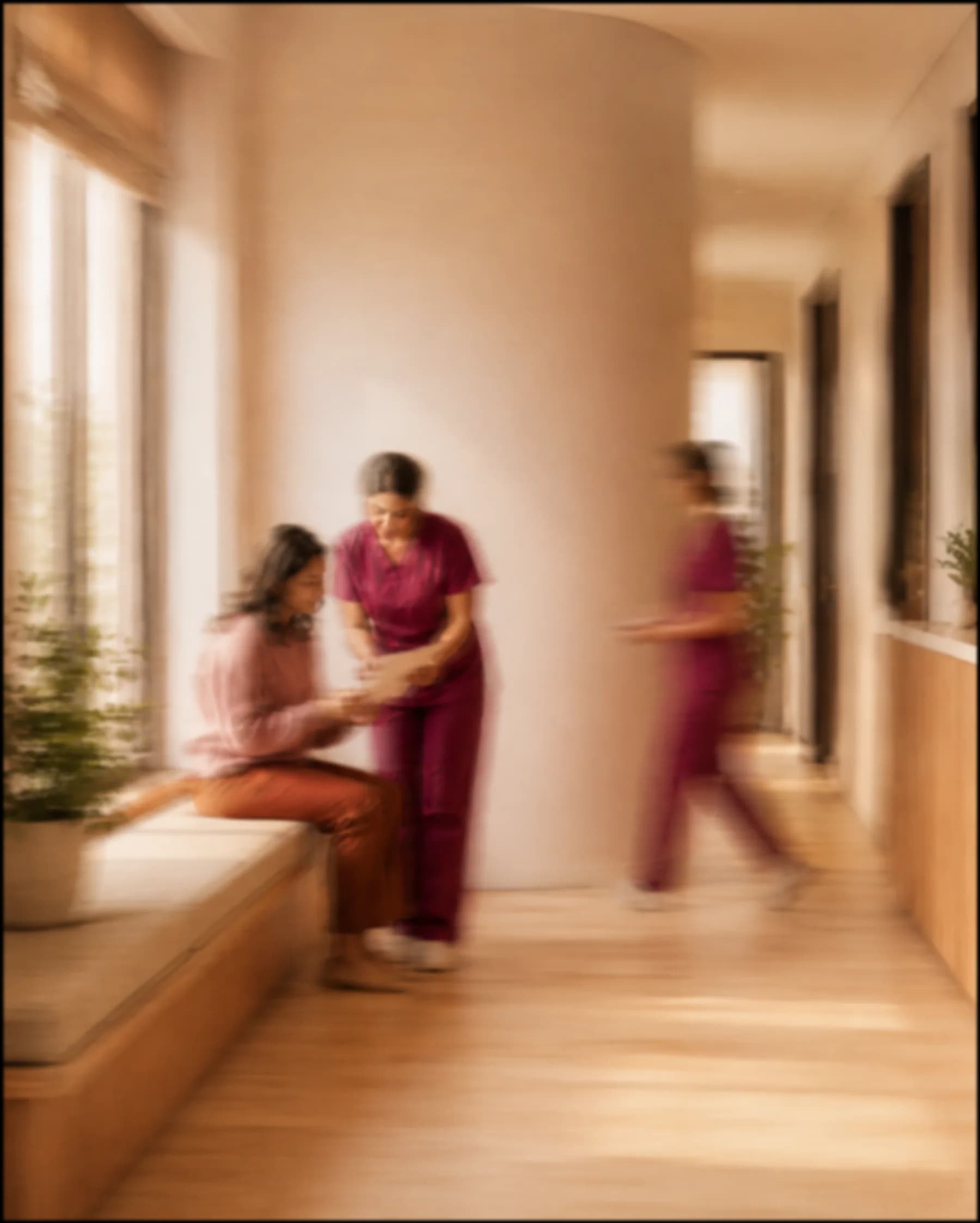 An Arva nurse with a patient by the window